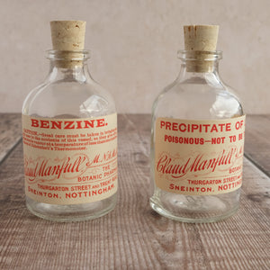 Small apothecary poison bottle featuring an original vintage label with a beautiful script design (Claud Manfull poison options)