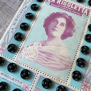 Art Nouveau style French card of vintage press studs (black).
