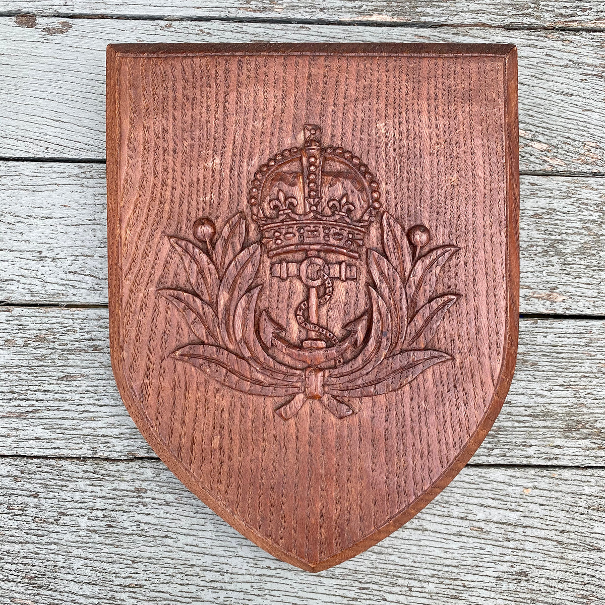 Royal Navy oak wall shield with brass plaque to the rear marked