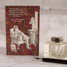 Load image into Gallery viewer, Pride and Prejudice quotation on red background card with glass inkwell and dip pen.