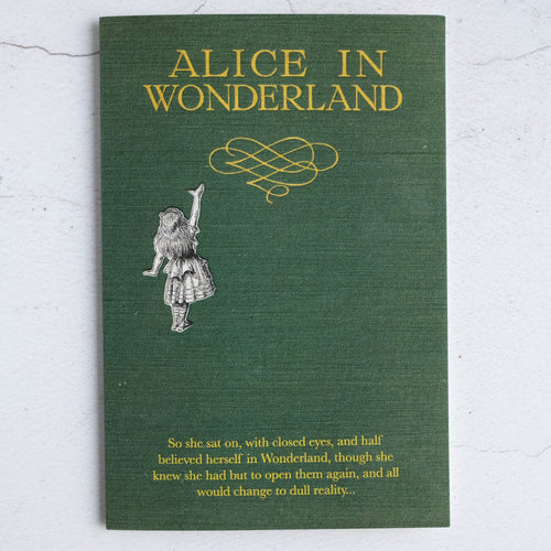 Green cloth Alice In Wonderland book design card with quotation from Alice's Adventures in Wonderland.