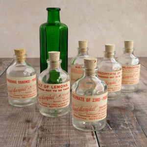Small apothecary poison bottle featuring an original vintage label with a beautiful script design (Claud Manfull poison options)