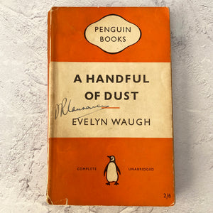 A Handful of Dust by Evelyn Waugh.  Penguin Books paperback 822.  1955.