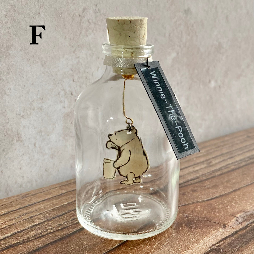 Winnie the Pooh Character in a Bottle.  Miniature glass bottle with original vintage book illustration inside.