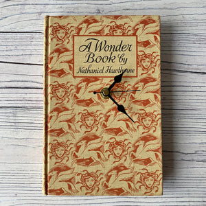 Book clock.  A Wonder Book by Nathaniel Hawthorne.  Medusa.  Pegasus.  Mythology.