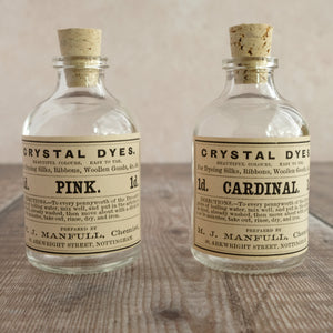 Small penny dye bottle featuring an original Victorian label