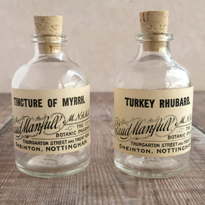Small apothecary bottle featuring an original vintage label with a beautiful script design (Claud Manfull options)