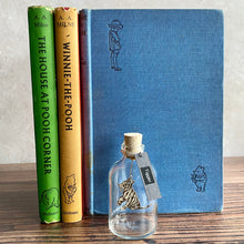 Load image into Gallery viewer, Winnie the Pooh Character in a Bottle.  Miniature glass bottle with original vintage book illustration inside.