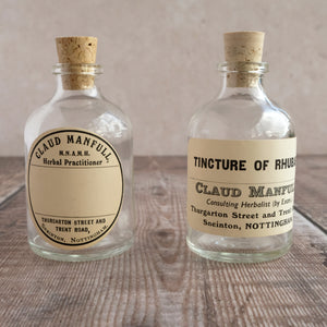 Apothecary bottle (small) featuring an original vintage label (Claud Manfull block lettering options)