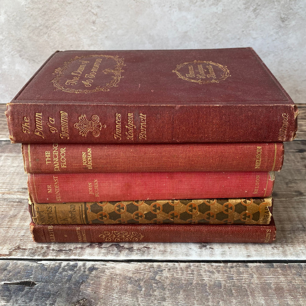 Stack of red vintage books